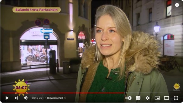 Screenshot eines TV-Beitrags mit Friendly Drive Fahrschule München zum Thema Bußgeld und Parkschein.